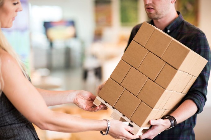 people holding a box