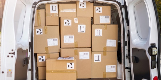 The back of a Van Open full of Boxes