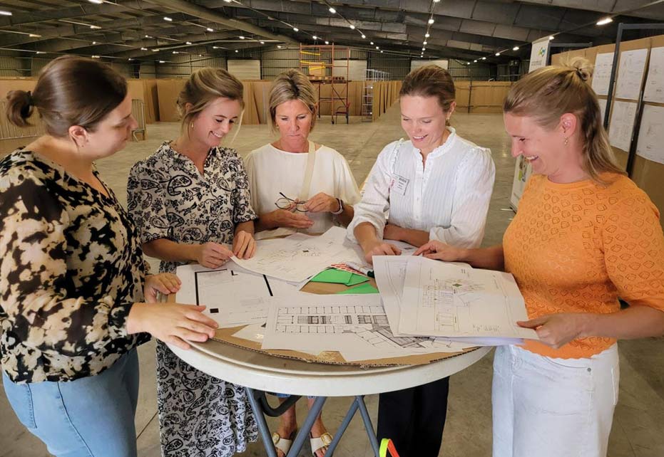 planning meeting for cardboard hospital